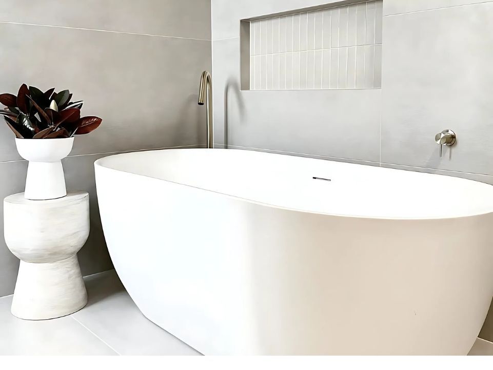 Big white bath tub in a minimalist bathroom