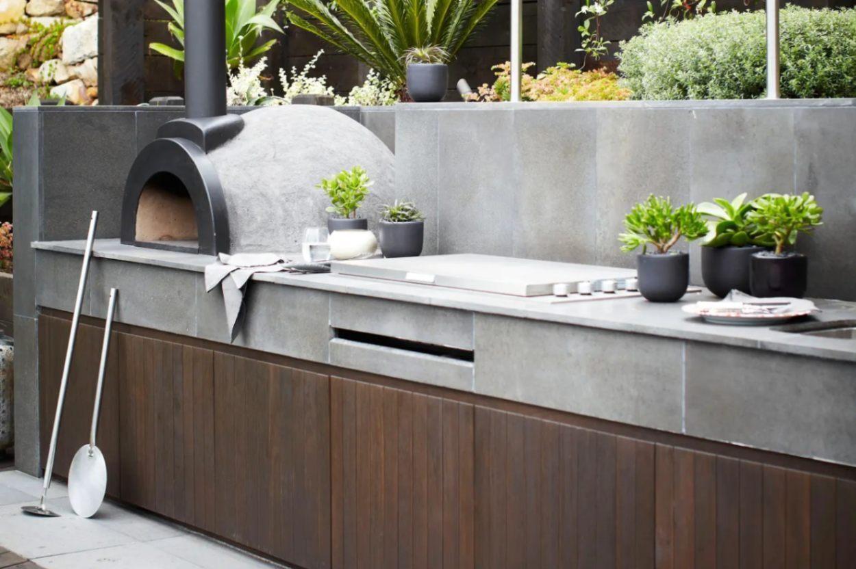 Bluestone paving used bench top and flooring in outdoor kitchen