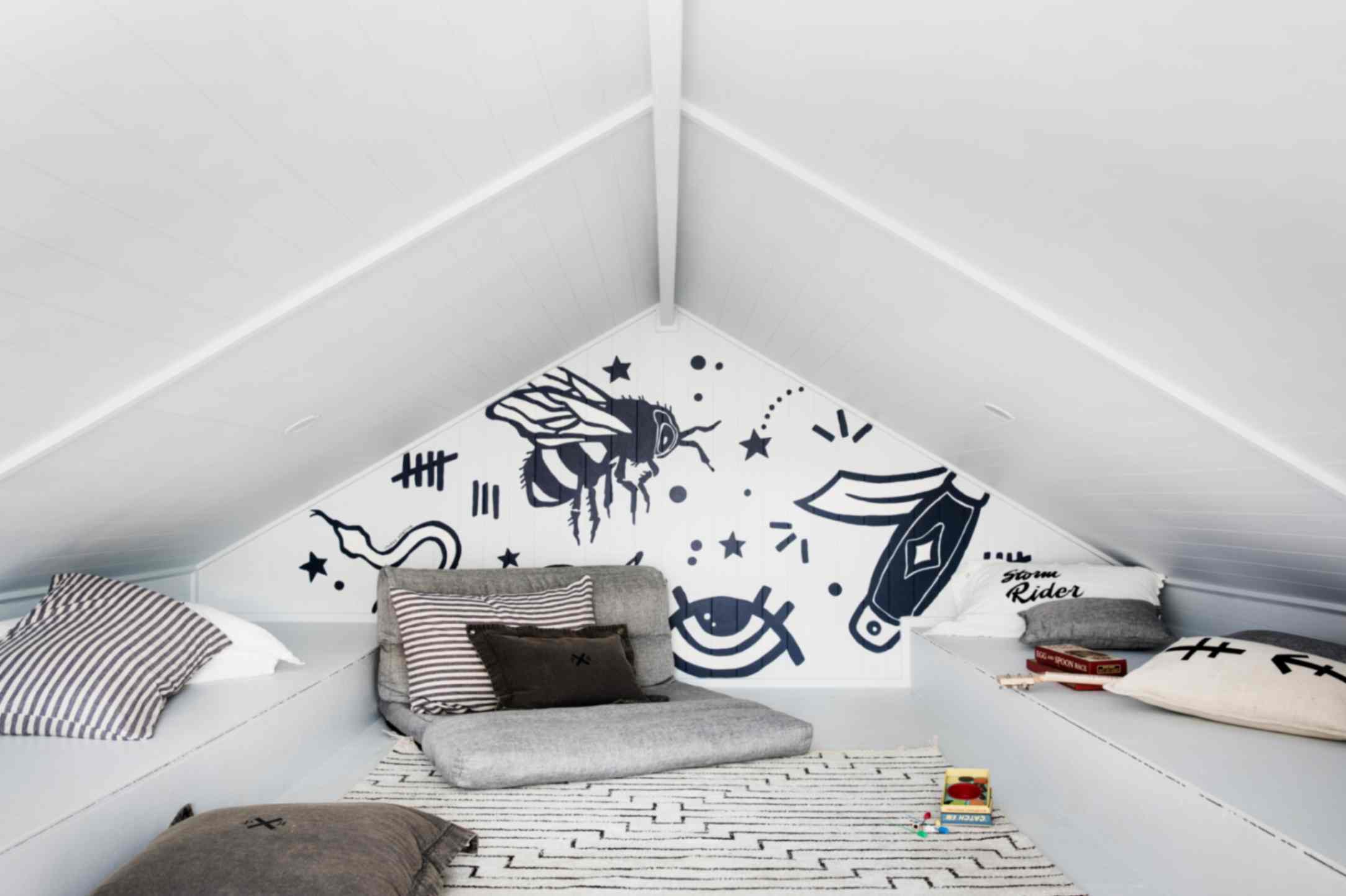 Dulux white on white attic with black and white cartoon feature wall