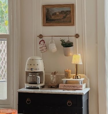Home Coffee Bar Ideas With Plants, artwork, and florals