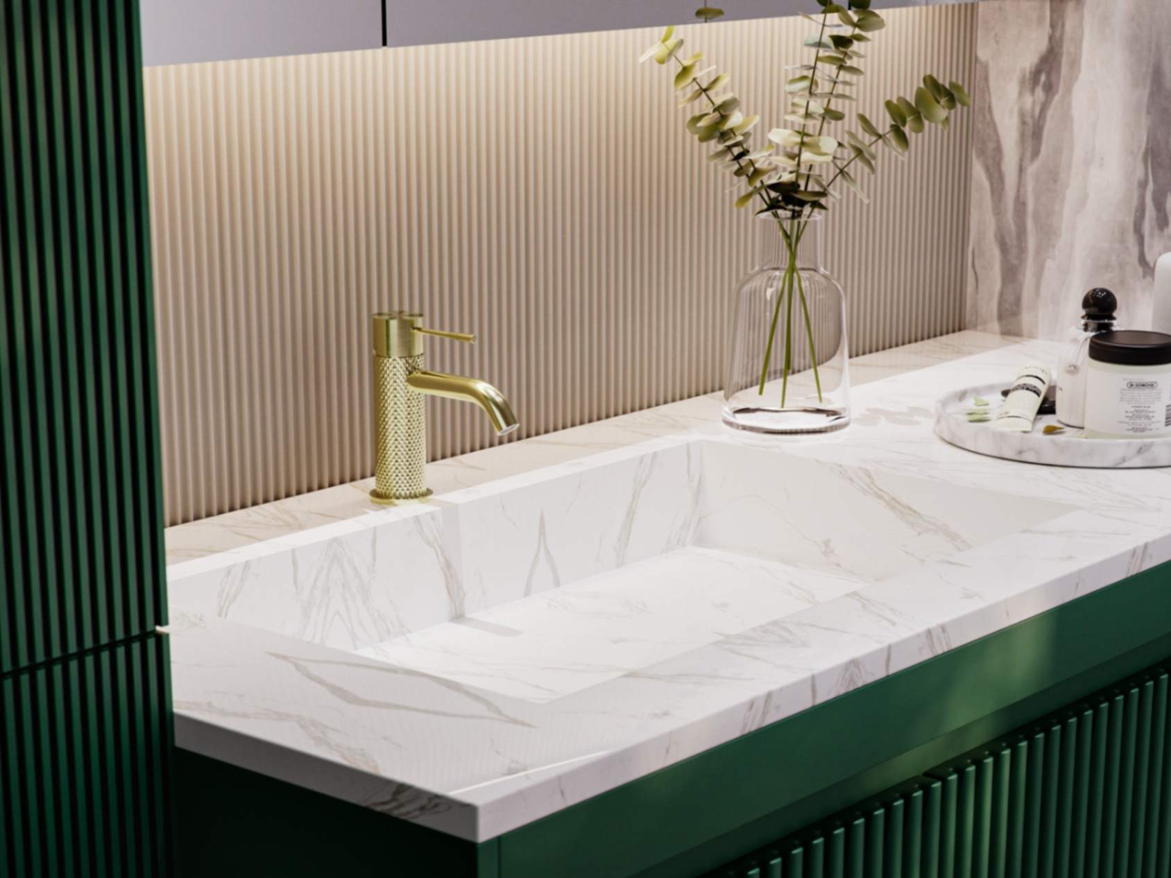 Marble vanity top with dark green cabinetry featuring nero tapware’s Opal basin mixer in brushed gold color