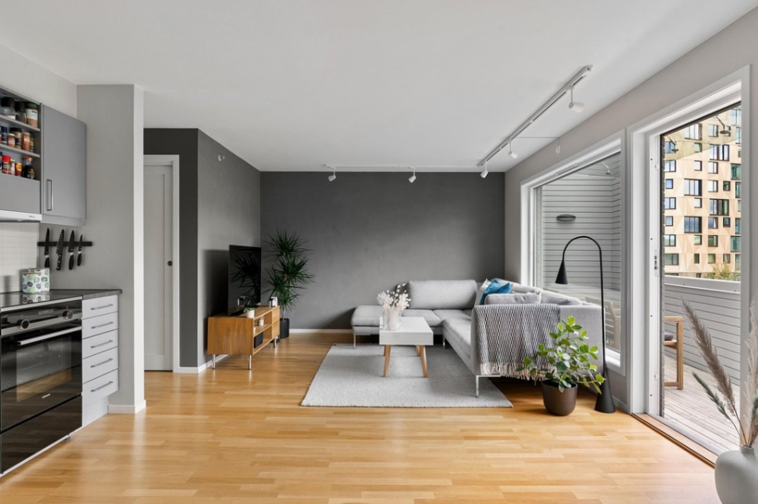 minimalist living room with wood-look flooring and grey walls